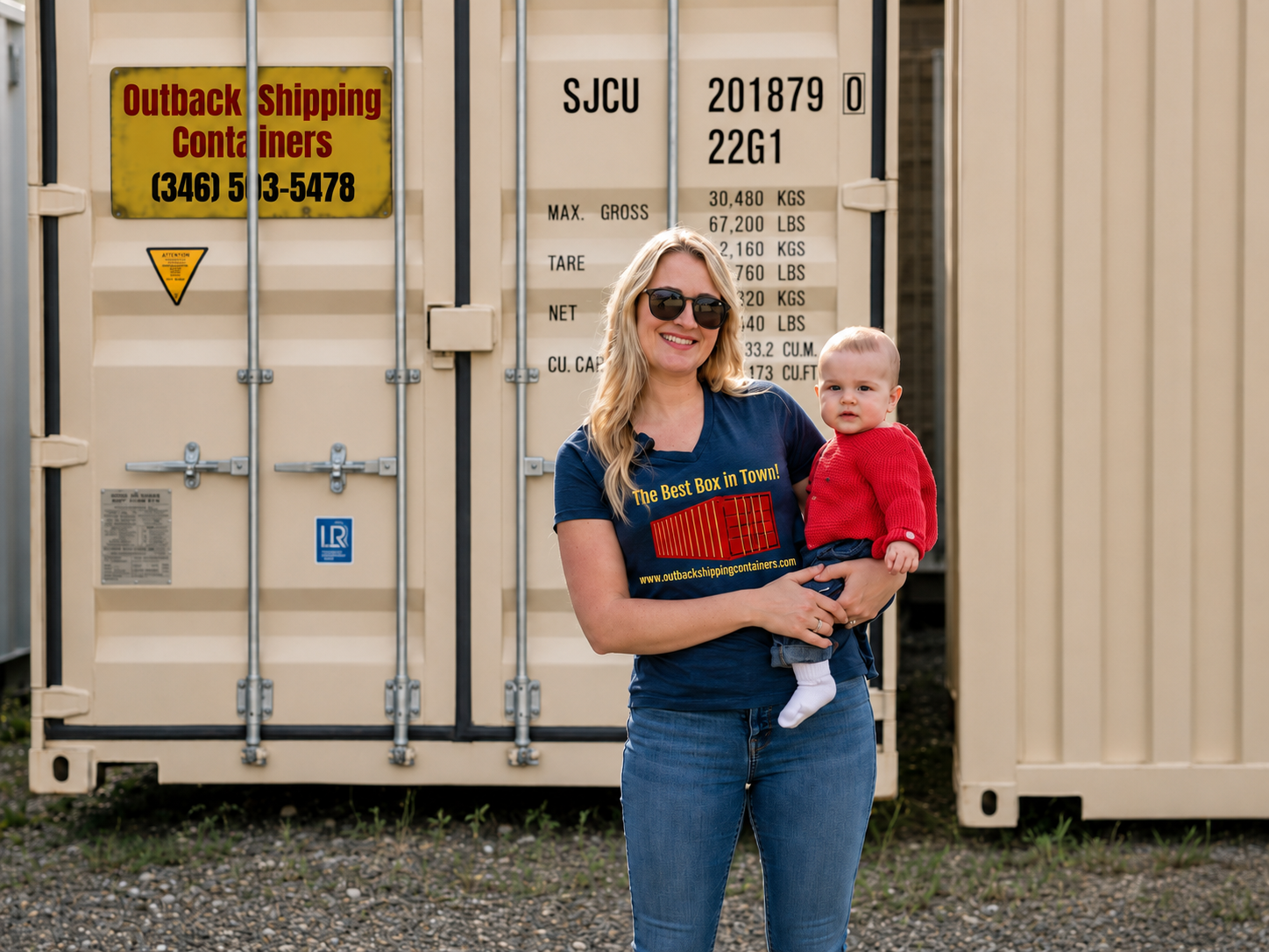 Outback Shipping Containers team member holding her child in front of a branded shipping container in Houston, TX